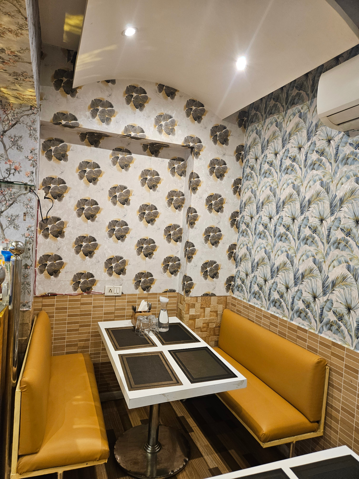 Private family booth with palm-leaf walls